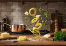 Fresh pasta ingredients floating in kitchen air