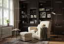 Cozy reading nook with armchair and dark bookshelves