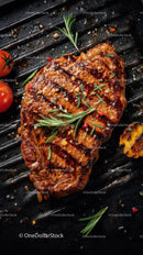Juicy Grilled Steak with Herbs and Cherry Tomatoes on Black Grill