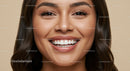 Close up of smiling woman with healthy teeth and glowing skin