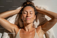 Woman Relaxing and Sunbathing with Glowing Skin in Outdoor Sunlight