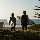 Two Surfers with Surfboards at Beach Ready for Waves