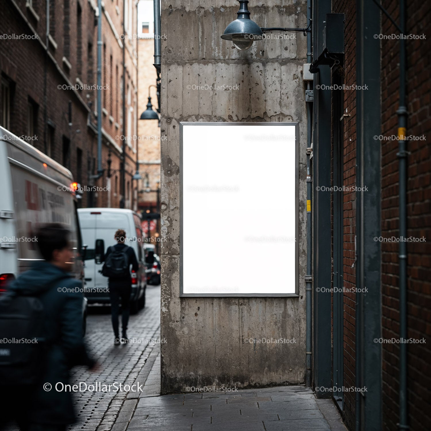Urban alley with blank poster on concrete wall