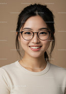 Portrait of a Smiling Young Woman with Glasses in Casual Attire