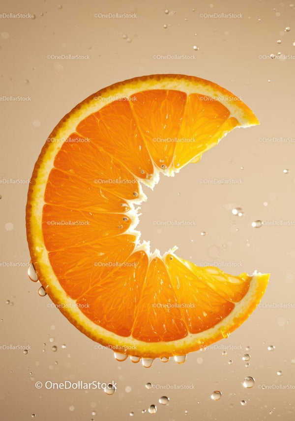 Fresh orange slice submerged in bubbling water