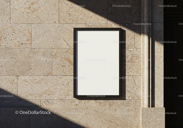 Blank poster frame on textured stone wall with shadows JPG Mockup Image