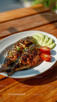 Grilled Fish with Fresh Vegetables on Wooden Table