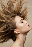 Profile of woman with flowing hair and soft makeup