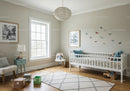 Bright and Cozy Children's Nursery with Butterfly Wall Decorations and Wooden Toys