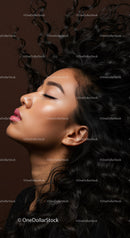 Serene young woman with flowing curly hair profile