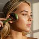 Close Up of a Woman Using a Jade Roller for Facial Skin Rejuvenation