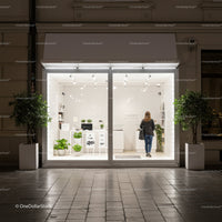 Modern minimalist shopfront with greenery at night