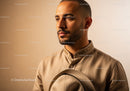 Stylish Male Portrait in Beige Shirt with Warm Background