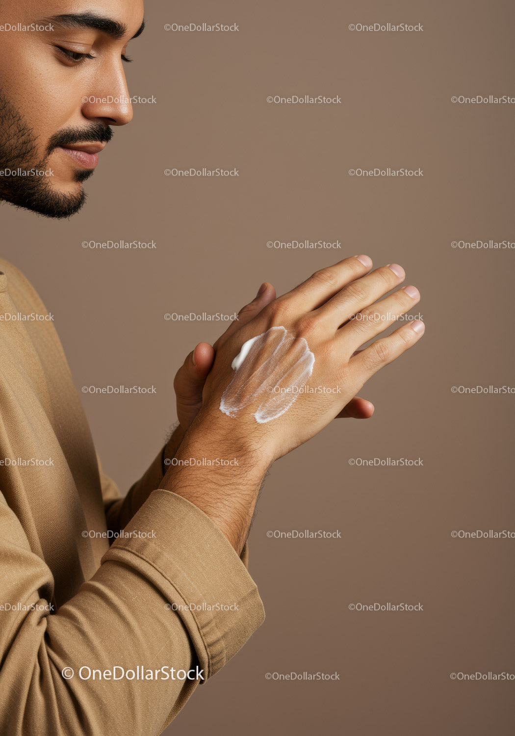 Man Applying Lotion to Hand Ushering Personal Grooming Routine