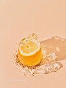 Refreshing lemon slice frozen inside melting ice cube