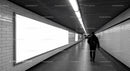 Minimalist Subway Tunnel with Tiled Walls and Modern Lighting