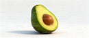 Fresh avocado half with large brown seed