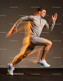 Male athlete in dynamic running pose with motion blur
