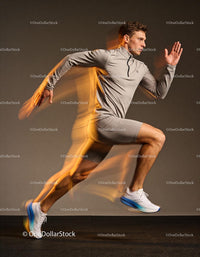 Male athlete in dynamic running pose with motion blur