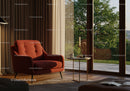 Cozy living room with red armchair and natural light