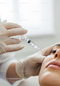 Close-up of Medical Professional Giving Injection to Patient