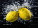 Vibrant Yellow Lemons Splash into Water in Dynamic Refreshing Scene
