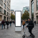 Busy urban street with blank advertising board and pedestrian motion