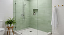 Modern minimalist bathroom with green tiled walk-in shower