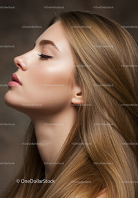 Profile of serene young woman with flowing hair