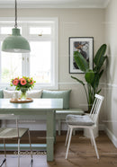Bright Cozy Kitchen Dining Area with Green Houseplant and Flowers