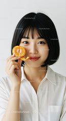 Portrait of a Young Woman with a Tangerine Slice Bright and Cheerful