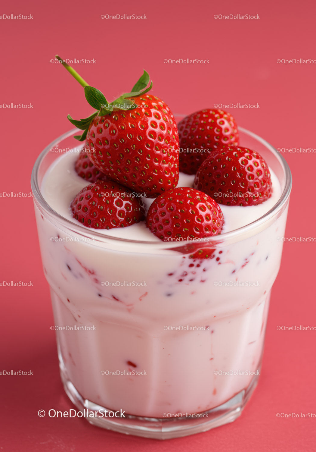 Fresh Strawberry Yogurt in Clear Glass on Pink