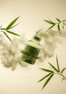 Glass Bottle with Green Powder and Bamboo Leaves