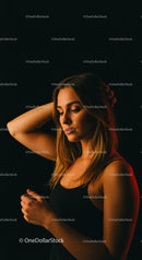 Thoughtful young woman in soft warm light posing