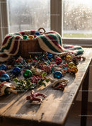 Cozy Rustic Table with Christmas Decorations and Blanket