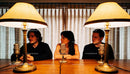 Group of young adults recording a podcast indoors