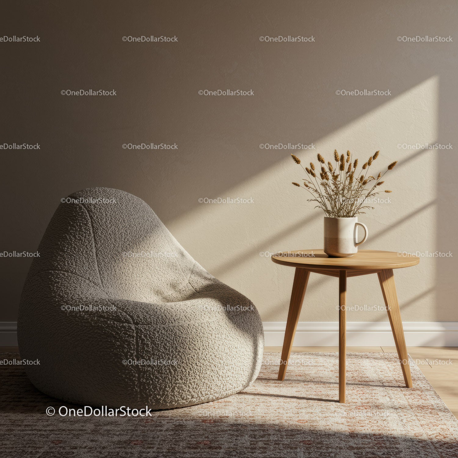 Cozy beige armchair with wooden side table and dried flowers