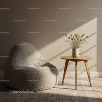 Cozy beige armchair with wooden side table and dried flowers