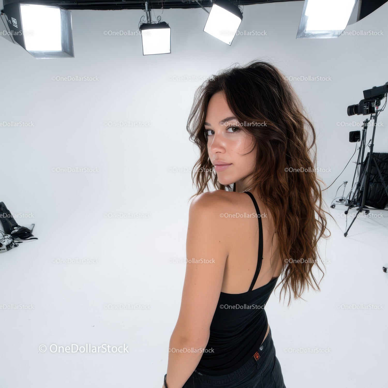 Fashionable Young Woman with Wavy Hair in Studio Portrait