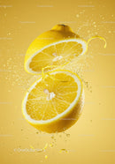 Fresh lemon halves with juice splash on yellow background