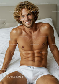Smiling man relaxing on bed in white underwear