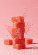 Stack of orange sugar-coated jelly candies with splash