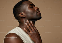 Elegant Portrait of a Man with Glowing Skin in a Minimalist Setting