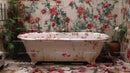Vintage Bathtub with Floral Wallpaper in Rustic Abandoned Bathroom