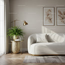 Minimalist living room with white sofa and green plant