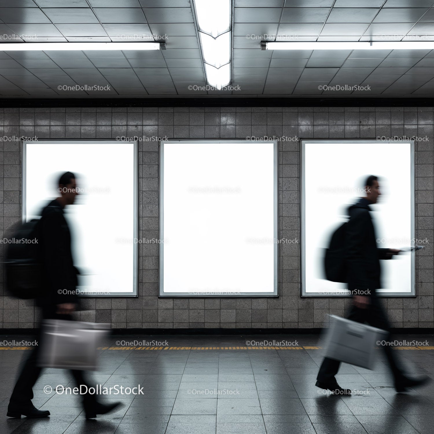 Blurred commuters walking past empty advertising panels