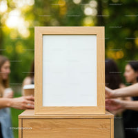 Wooden Frame on Table with Blurred Friends in Garden