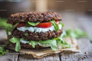 Healthy Vegan Oatmeal Burger with Tomato and Lettuce on Rustic Wood