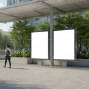 Urban bus stop with blank advertising screens and pedestrian