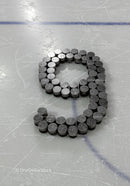 Hockey Pucks Arranged in Number Nine on Ice Rink